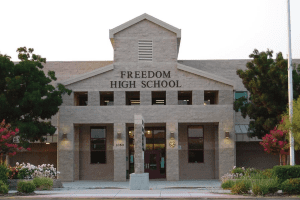Picture of the front of Freedom High School where an annual summer conference brings together teachers and leaders from across the country for an intensive 3-Day event.